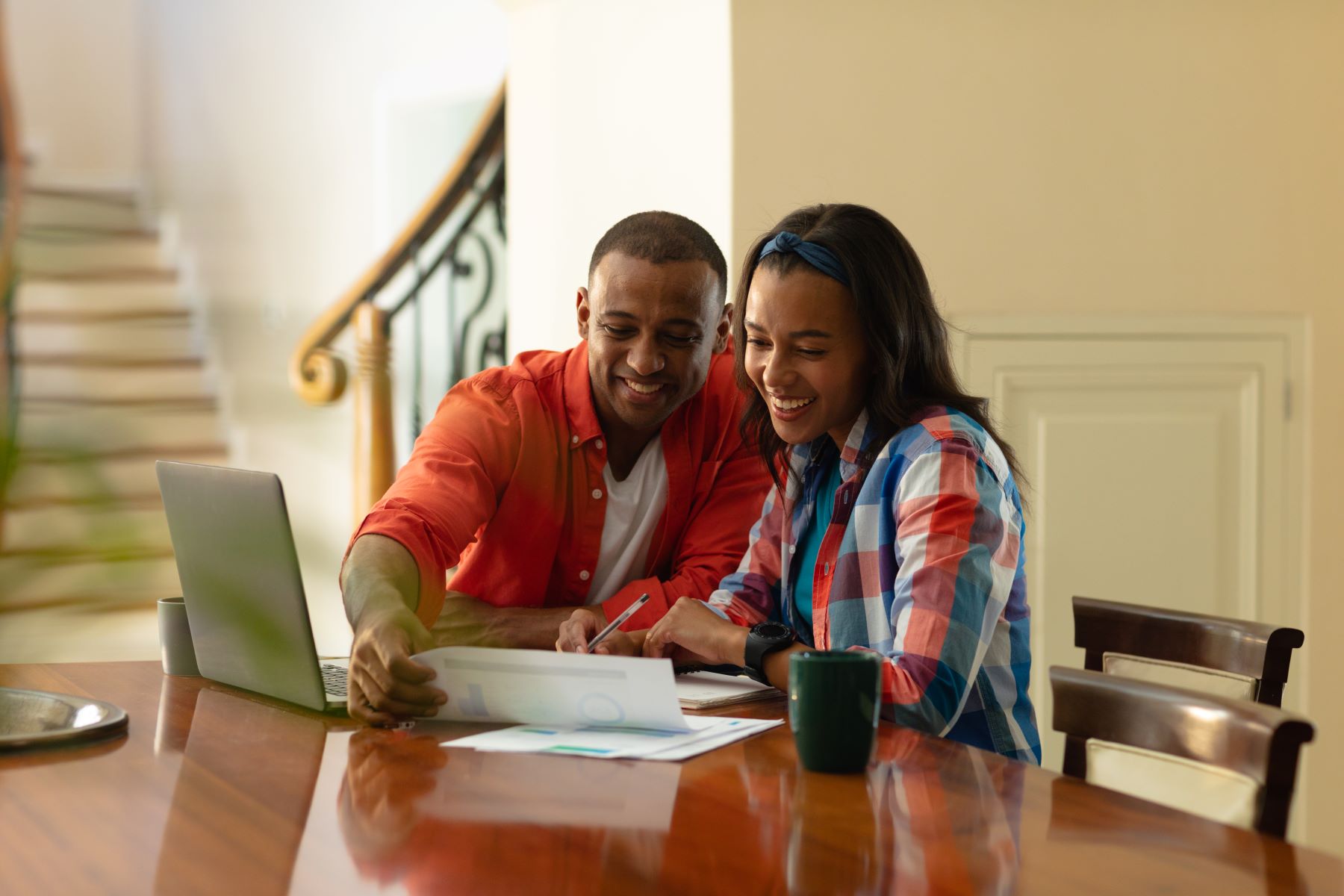 Smiling African American Couple Discussing On Financial Bills