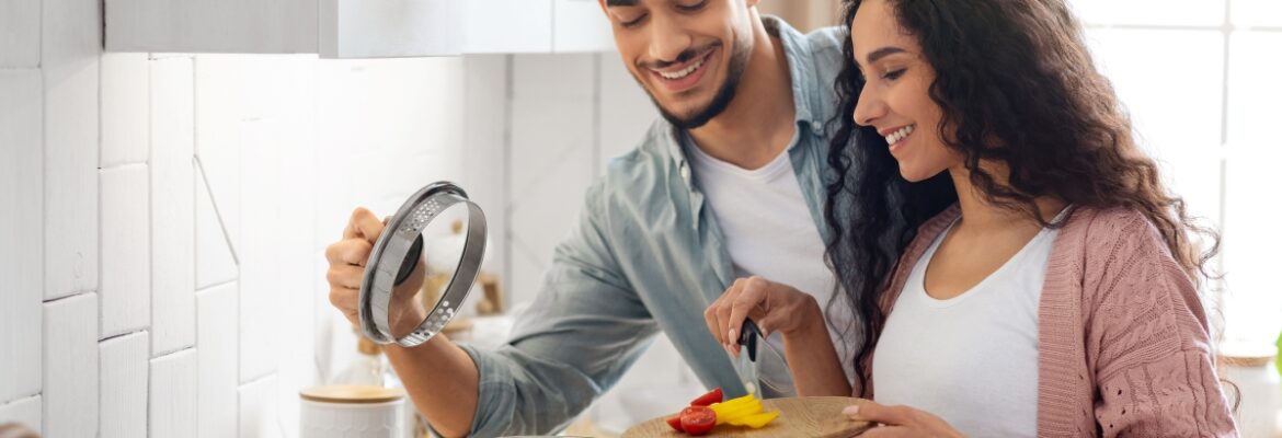 Happy Young Couple Cooking Healthy Food On Gas Stove Propane Clean Gas