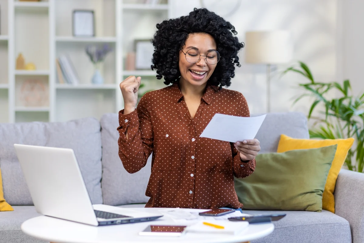 African American Young Woman Checking Bills African American Young Woman Checking Bills