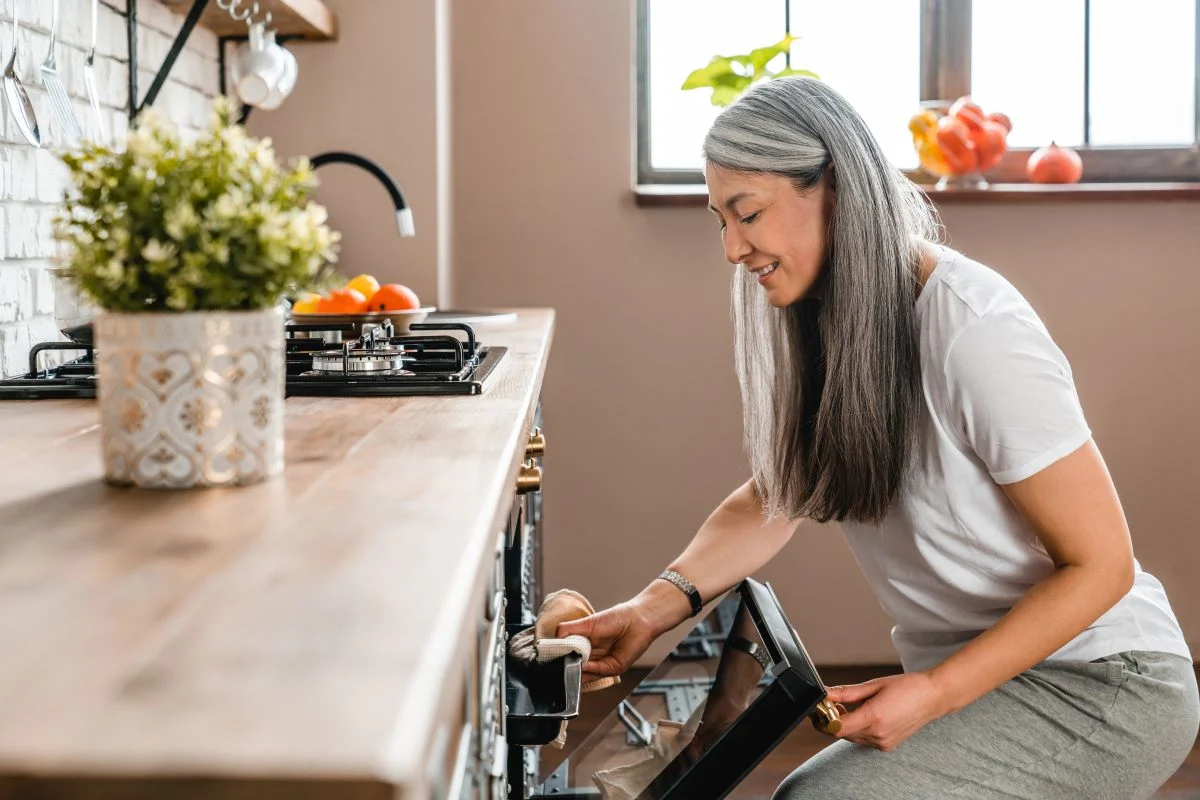 Mature Beautiful Caucasian Woman Baking In The Oven Mature Beautiful Caucasian Woman Baking In The Oven