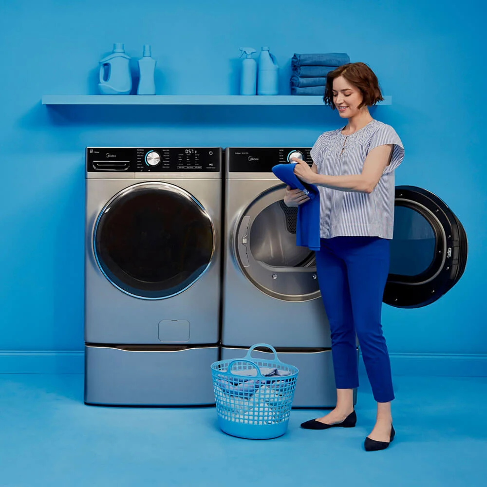 Woman With Propane Gas Dryers In Home Woman With Propane Gas Dryers In Home